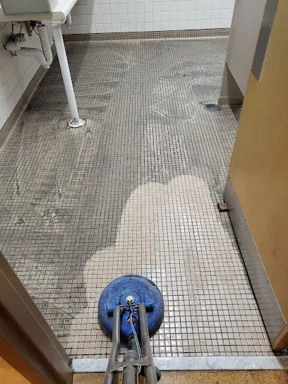 Tile floor cleaned with a spinner tool after water damage in Hillsborough County