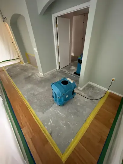 Wet flooring removed with an LGR dehumidifier drying the slab in a Plant City hallway