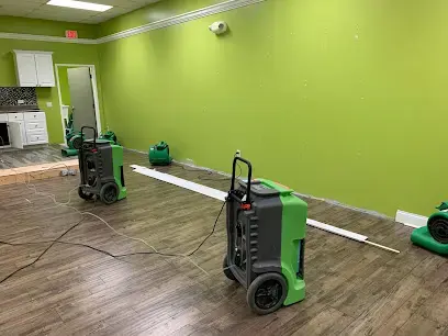 Dehumidifiers and air movers drying a commercial room in east Hillsborough County