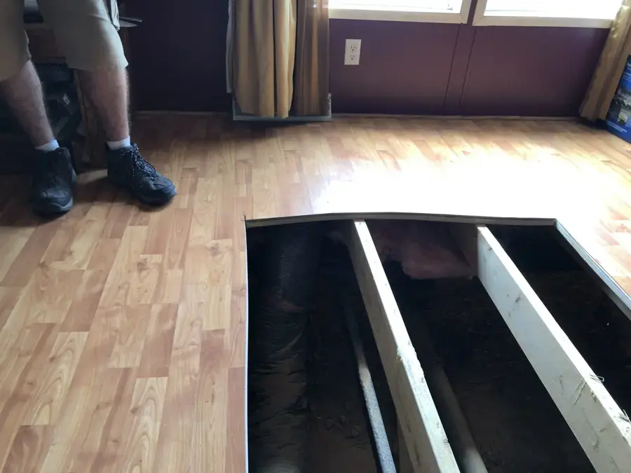 Manufactured home floor opened to wet joists after a leak near Plant City